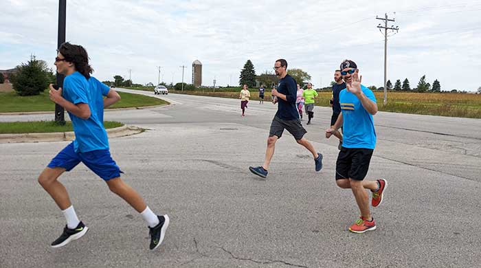 converge-news-story-6di-runners Runner waving hello