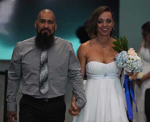 converge-story-orchard-church-wedding-couple-1 Couple walking down isle